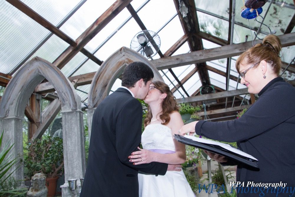 Photo of couple kissing at altar