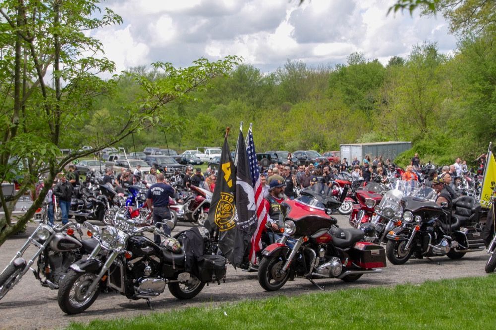 Photo of crowd of people and motorcycles